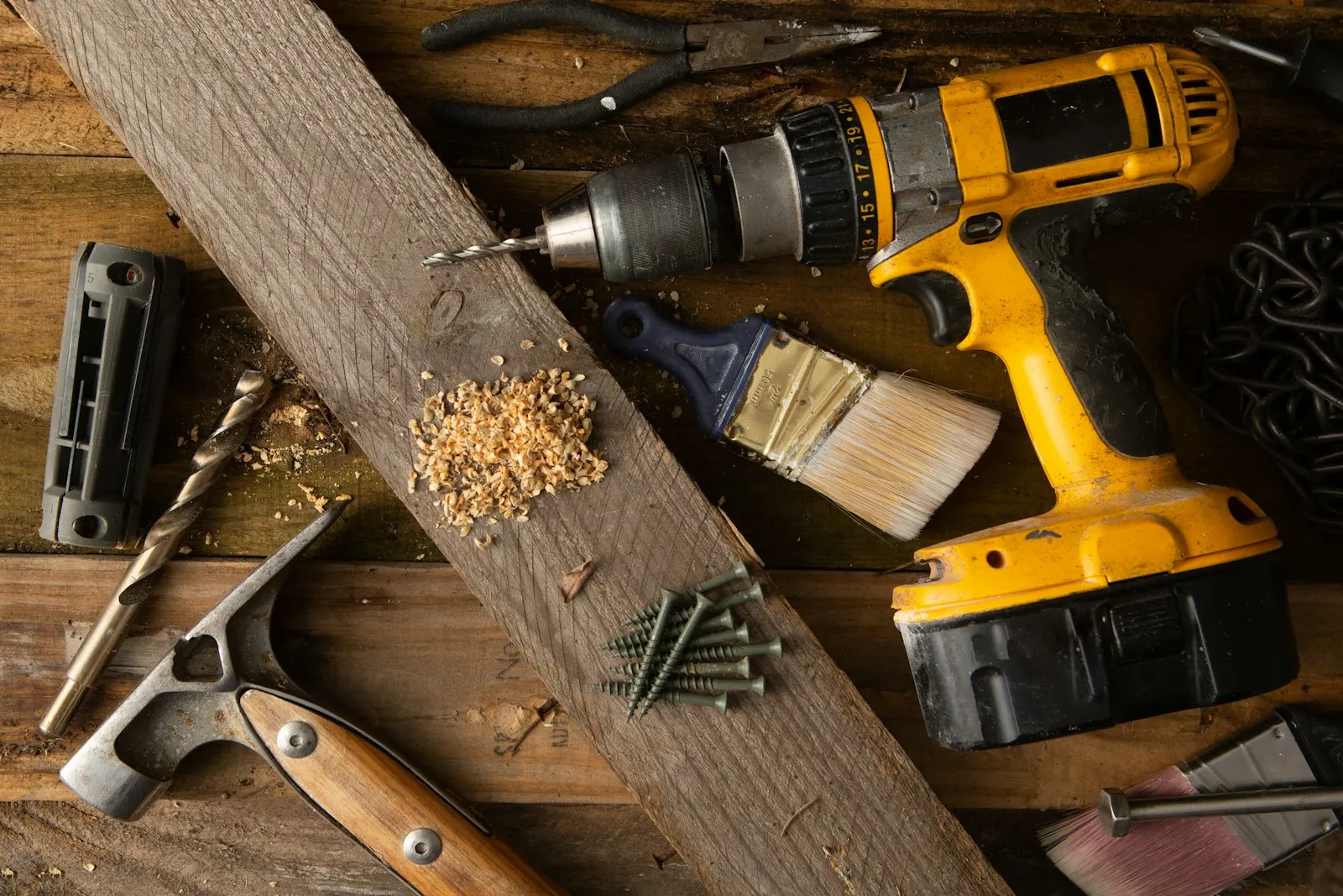 Hand tools arranged on a wooden work surface